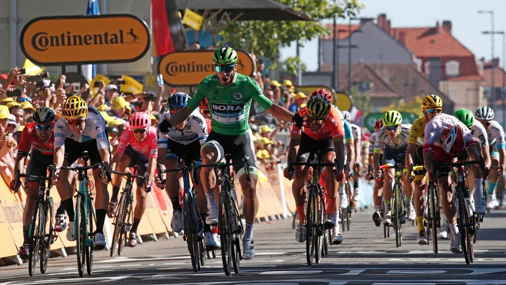 Slovakia’s Peter Sagan of Bora Hansgrohe team celebrates his win after crossing the finish line following the fifth stage of the Tour de France between Saint Die des Vosges and Colmar. Photo: Yoan Valat/EPA