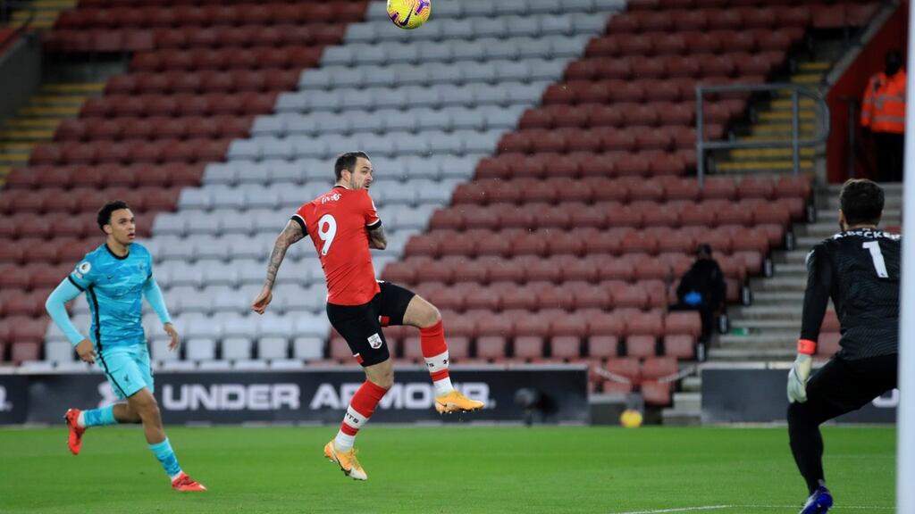 Danny Ings of Southampton lobs Alisson Becker of Liverpool to score the opening goal during the Premier League clash at St Mary’s. Photo: Adam Davy/EPA