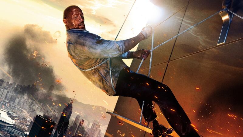Dwayne ‘The Rock’ Johnson in Skyscraper. Photograph; Kimberley French/ © Universal Pictures