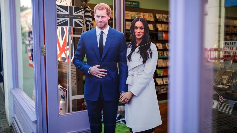 A cardboard cut-out display of Prince Harry and his fiance US actress Meghan Markle sits outside a card shop ahead of the couple’s wedding. Photograph: Jack Taylor/Getty Images