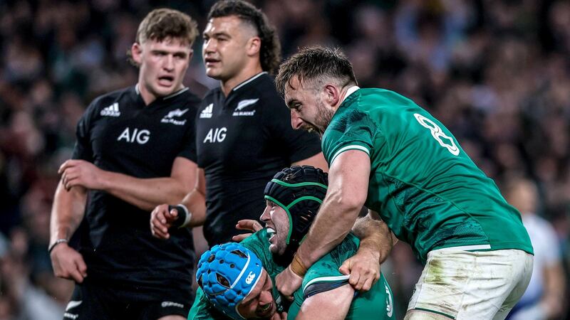 Ireland’s Caelan Doris celebrates after scoring a try with Tadhg Beirne and Jack Conan. Photograph: Gary Carr/Inpho