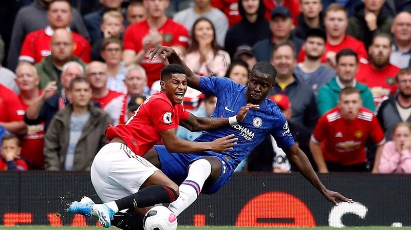 Chelsea’s Kurt Zouma brings down Rashford to concede a penalty. Photo: Martin Rickett/PA Wire