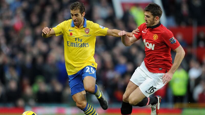 Mathieu Flamini cut the sleeves off his Arsenal shirt during a 2013 Premier League match with Manchester United. Photograph: David Price/Arsenal FC via Getty Images