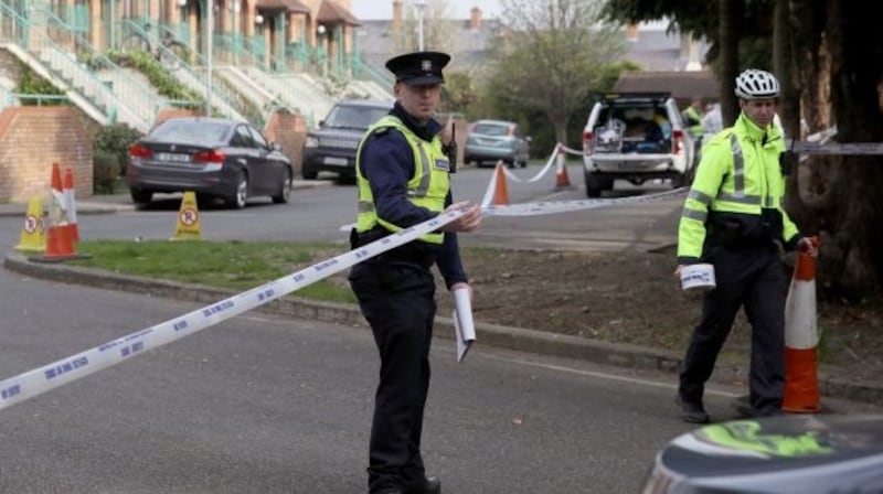Gardaí at the scene in Rathmines, Dublin, last April where the remains were found on a tree-lined common area close to apartments. Photograph: Brian Lawless/PA Wire