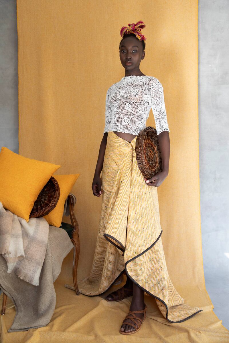 Crios belt worn as headpiece (€75), blanket worn as skirt (€250), Irish linen cushions from €90, lace top stylist’s own, sciobs (baskets) from a selection exclusive to Stable. Photograph: Barry McCall