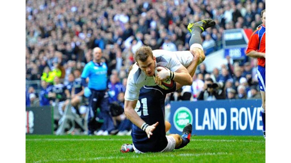 Tom Croft bursts through the tackle of Dan Parks to score the decisive try at Twickenham this afternoon. Photograph: Toby Melville/Reuters