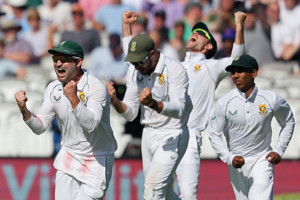 South Africa captain Dean Elgar and team-mates celebrate after England's James Anderson is bowled by Marco Jansen to wrap up the first Test on day three at Lord's. Photograph: Adrian Dennis/AFP via Getty Images
