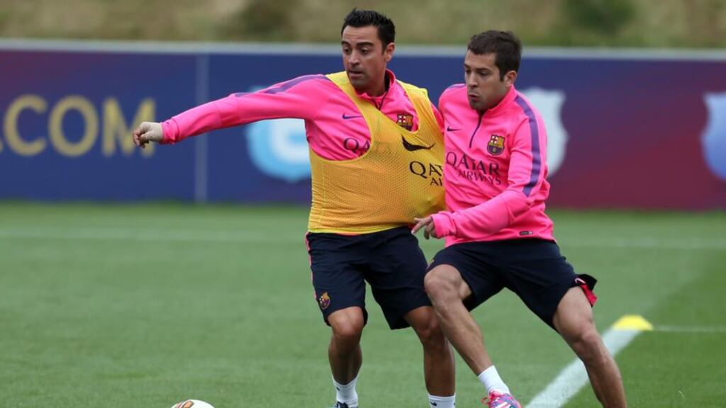 Barcelona’s Xavi (left) during the training session at St George’s Park, Burton-Upon-Trent. The Spaniard has announced that he will retire from international football. Photograph: Simon Cooper/PA Wire