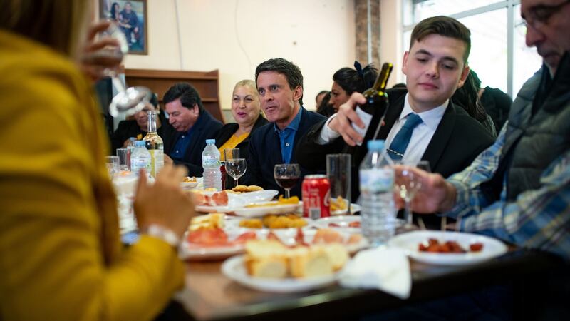 Former French prime minister and mayoral candidate for Barcelona Manuel Valls (centre) meets members of the local gypsy community. Photograph: Josep Lago