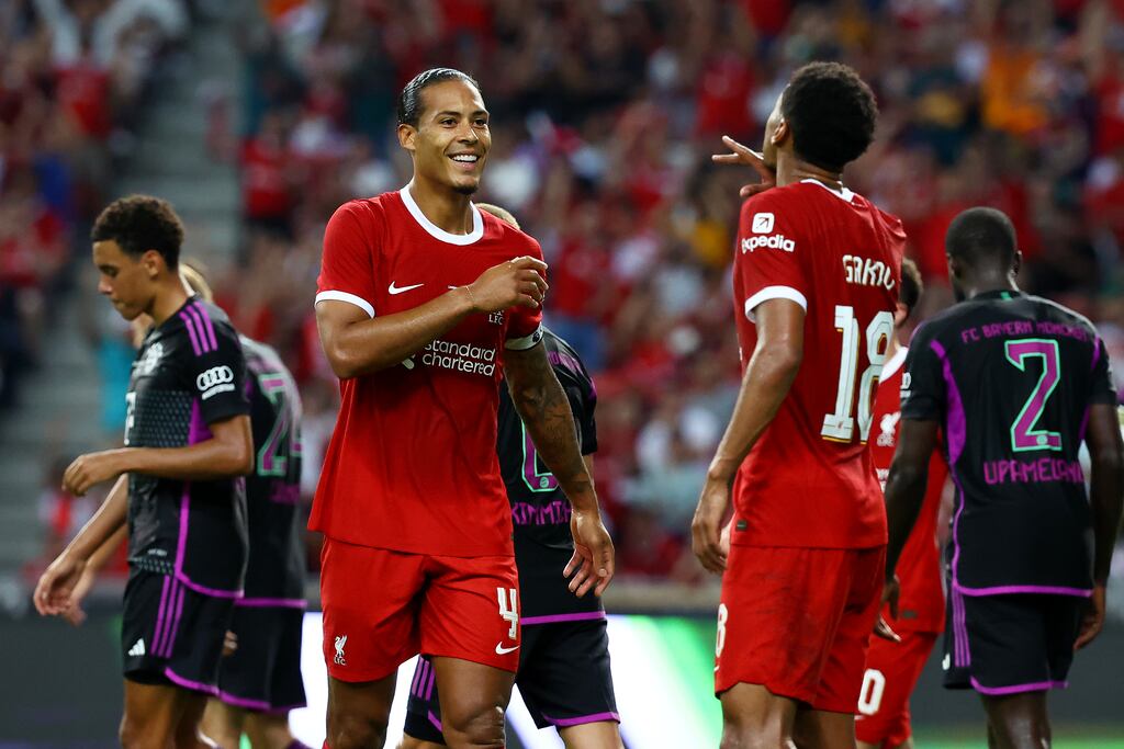 Virgil van Dijk and Cody Gakpo celebrate a goal against Bayern Munich during a preseason friendly at the National Stadium in Singapore. 'It will be very tough if we look at the teams around us, but we want to be up there again, we want to be challenging again.' Photograph: Yong Teck Lim/Getty Images