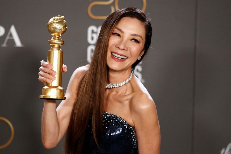 Michelle Yeoh with the Golden Globe for best actress. Photograph: EPA-EEE