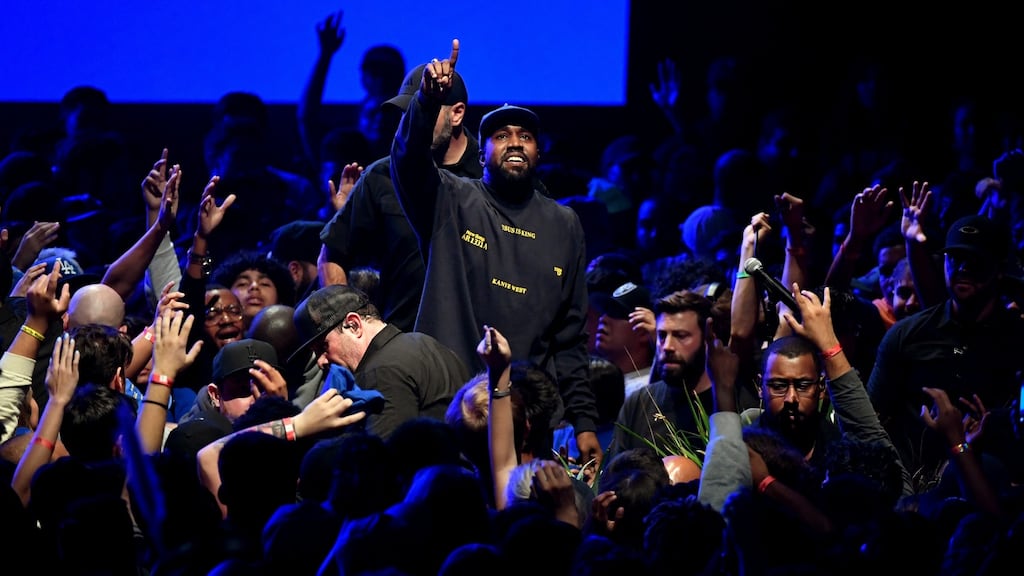 Kanye West performs onstage during his Jesus Is King album and film experience at The Forum, in Inglewood, California, on Wednesday. Photograph:  Kevin Winter/Getty Images for ABA