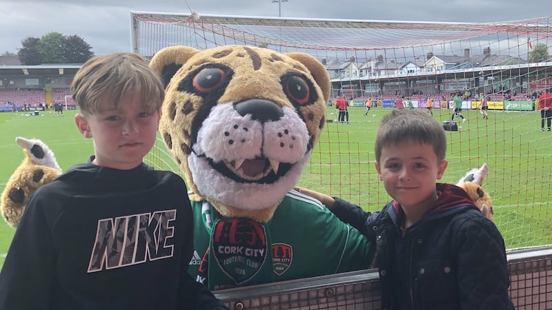 Charlie and Finn Hannigan with the Cork City mascot at a game in Turner’s Cross in Cork.