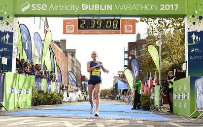 Laura Graham of Mourne Runners, Co Down, crosses the line to be the first Irish finisher in the women's category of the 2017 Dublin Marathon. Photograph: Sam Barnes/Sportsfile