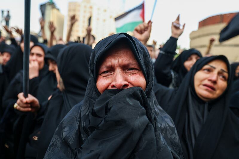 Women cry as people gather at Valiasr Square in Tehran to mourn the death of president Ebrahim Raisi and foreign minister Hossein Amir-Abdollahian in a helicopter crash. Photograph: Atta Kenare/ AFP via Getty Images