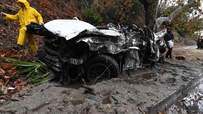Mud fills a street after a rain-driven mudslide destroyed two cars and damaged property in a neighbourhood under mandatory evacuation in Burbank, California. Photograph: Robyn Beck/AFP/Getty Images