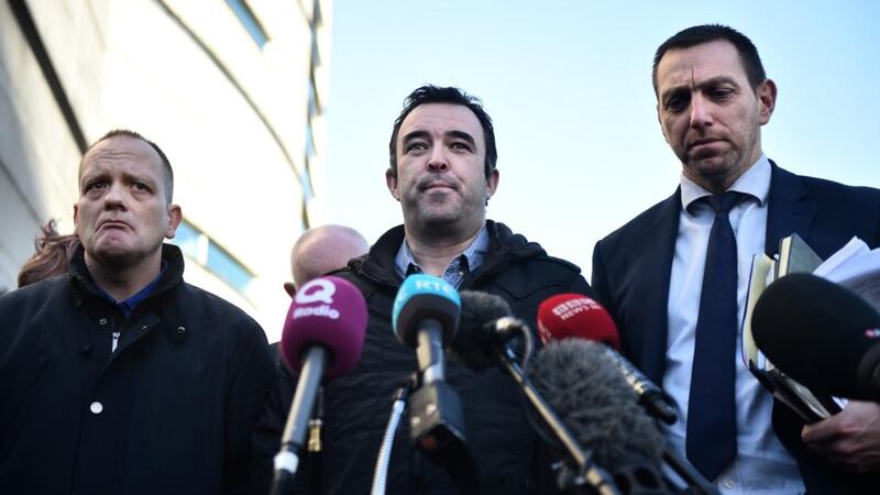 Gary Haggarty murders: Kieran Fox (centre), son of Haggarty’s victim Eamon Fox, outside court with Aaron McCone, son of John Harbison, and solicitor Pádraig Ó Muirigh. Photograph: Charles McQuillan/Getty