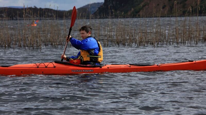 Eamon tries his hand at kayaking on Caragh Lake.
