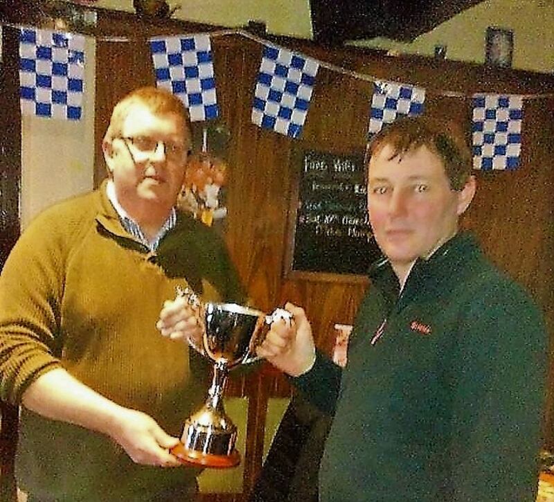 Michael Sheehan (left) presents the Carrigavantry Cup to Robert Crichton