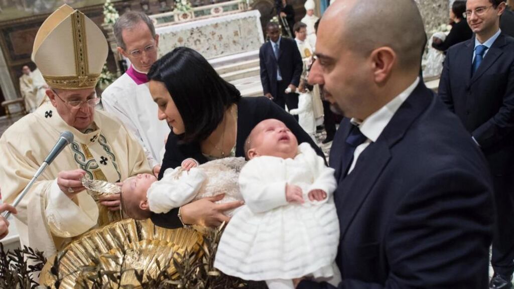 A photograph made available by Vatican paper Osservatore Romano of Pope Francis, baptising a baby at the Vatican yesterday. Photograph: Osservatore Romano Press Office/EPA