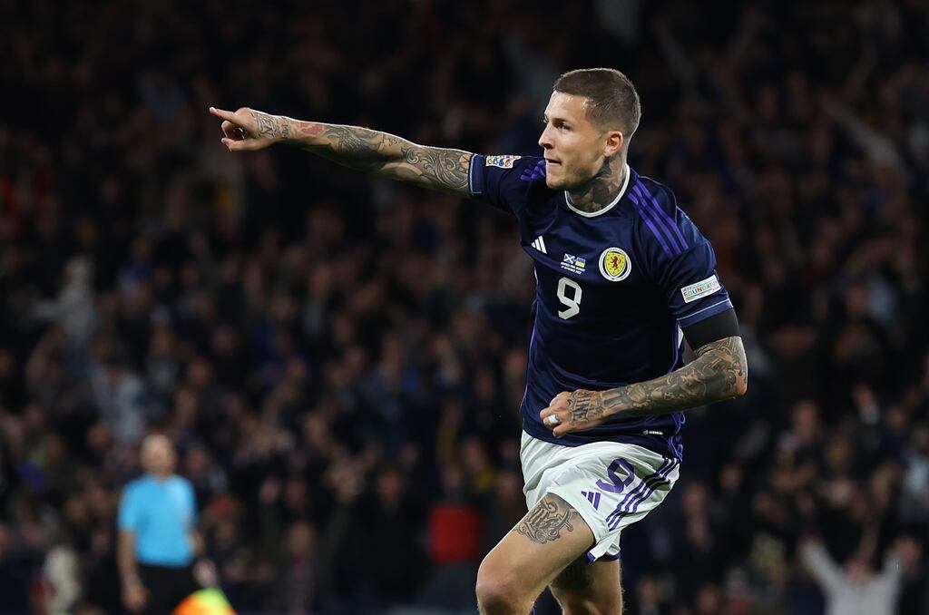 Lyndon Dykes of Scotland celebrates scoring his team's third goal. Photograph: Ian MacNicol/Getty Images