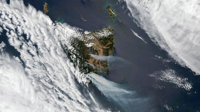Photo from Nasa’s Earth Observatory showing large fires fuelled by extremely dry and hot conditions that have been burning for almost two weeks in central and southeast Tasmania. The Tasmania Fire Service has issued several emergency warnings to residents to relocate, as dangerous fire conditions and strong wind persist. Photograph: Nasa Earth Observatory/Lauren Dauphin/EPA