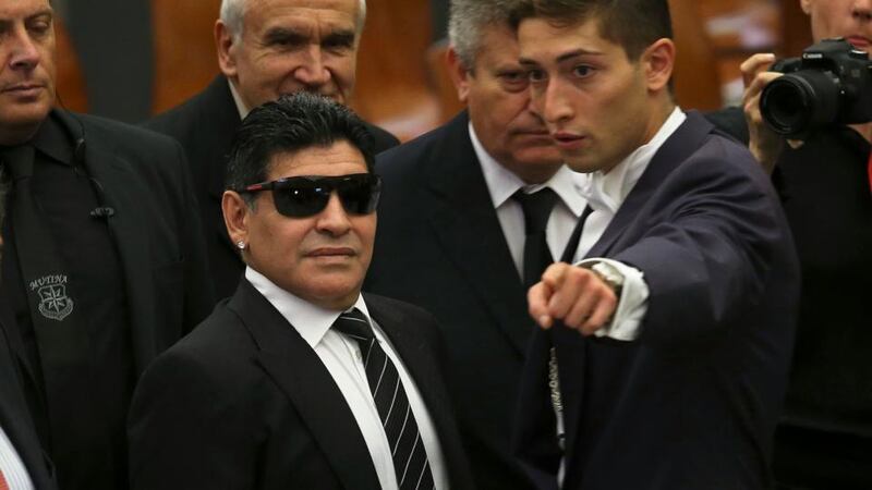 Former soccer star Diego Maradona (L) arrives at Paul VI hall at the Vatican today to meet Pope Francis for a special audience held before a special interreligious “Match for Peace”. Photograph: Alessandro Bianchi/Reuters.