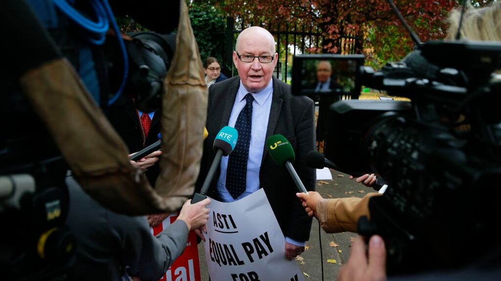 A file image of ASTI president Ed Byrne  with striking teachers at Dominican College, Griffith Avenue, Dublin. Industrial action by ASTI members from Monday may lead to the closure of hundreds of secondary schools. Photograph: Nick Bradshaw
