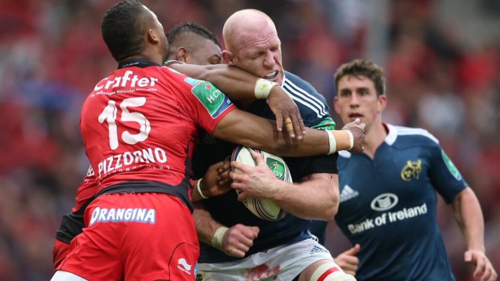 Munster’s Paul O’Connell is tackled by Toulon’s Delon Armitage in yesterday’s bruising semi-final battle in Marseille. Photograph: Billy Stickland/Inpho
