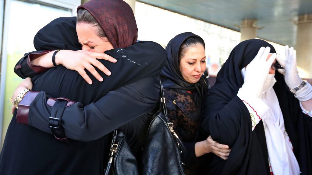 An Iranian hugs her mother upon her arrival back in Tehran, Iran, after performing the hajj in Mecca, Saudi Arabia. Photograph: Abedin Taherkenareh/EPA