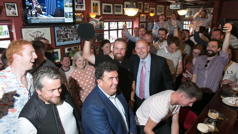 British Open champion Shane Lowry celebrates with fans at the Boar’s Head pub in Dublin. Photograph: Gareth Chaney/Collins