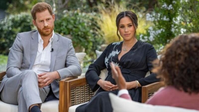 Prince Harry and Meghan Markle with Oprah Winfrey. Photograph: Joe Pugliese/Harpo via AP