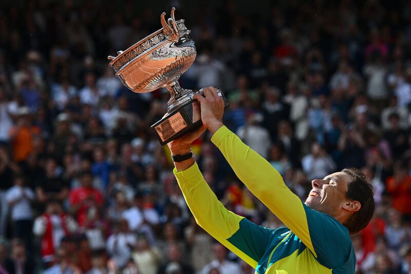 Spain's Rafael Nadal poses with The Musketeers' Cup as he celebrates his French Open win. Photograph:  Anne-Christine Poujoulat/AFP via Getty Images