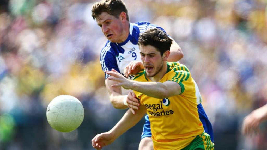 Ryan McHugh of Donegal in action against Monaghan’s Darren Hughes during the Ulster SFC Final in Clones. Photograph:  Cathal Noonan/Inpho