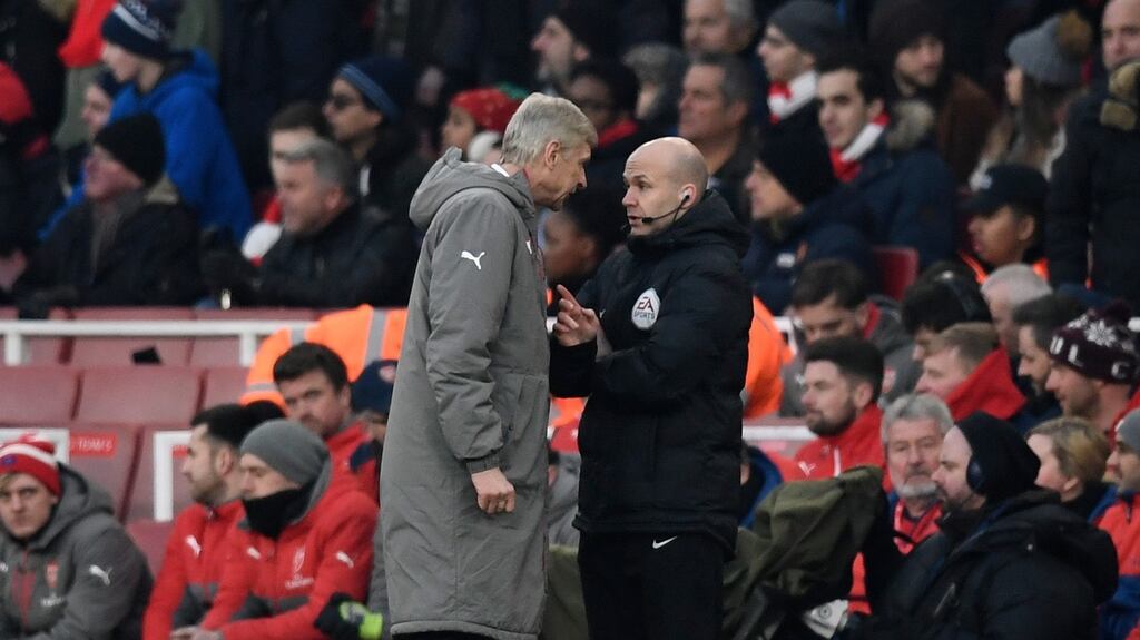 Arsenal manager Arsene Wenger clashes with fourth official Anthony Taylor during the Premier League game against Burnley. Photograph: Dylan Martinez/Reuters/Livepic