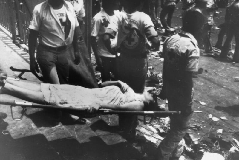 A woman is carried away on a stretcher after rioting and killing at Romero’s funeral on March 30th, 1980 which was attended by more than 250,000 people. Estimates of how many died range from 30 to 50. Photograph: Keystone/Getty