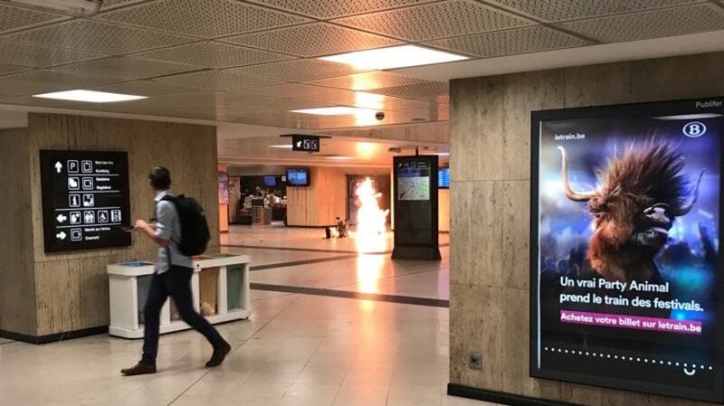 Fire is seen at Brussels central station in Belgium. Courtesy Twitter/@remybonnaffe/Reuters