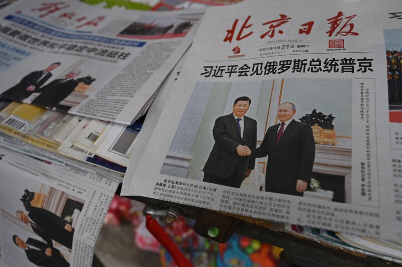 Newspapers featuring a front page photo of Chinese President Xi Jinping meeting with Russian President Vladimir Putin in Moscow, are displayed at a news stand in Beijing on Tuesday. Photograph: Greg Baker/AFP via Getty Images