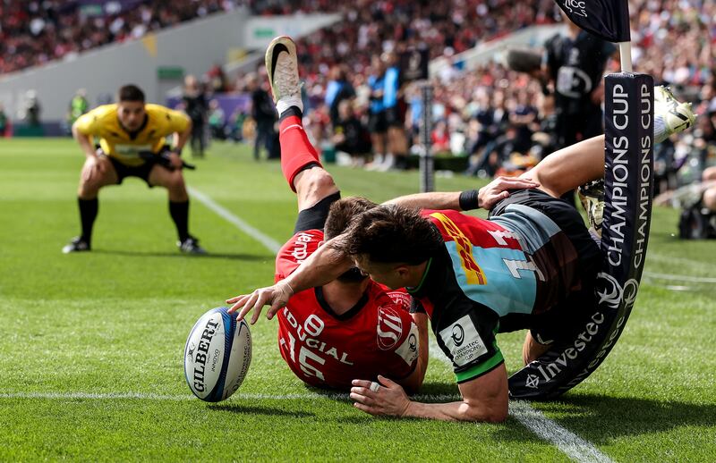 Harlequins' Cadan Murley scores a try despite the attempt of Toulouse's Blair Kinghorn to stop him during the Investec Champions Cup semi-final. Photograph: Gary Carr/Inpho