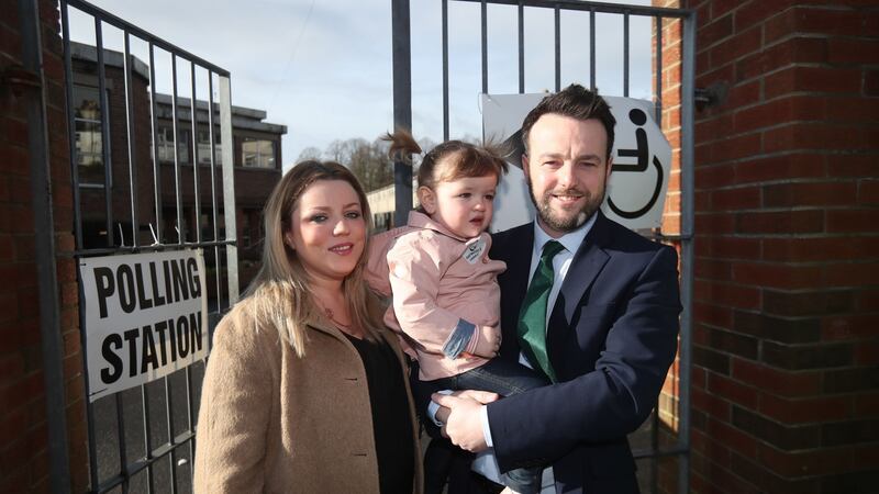 SDLP leader Colum Eastwood with wife Rachael and daughter Rosa arriving at Model primary school in Derry. Photograph: Niall Carson/PA Wire.
