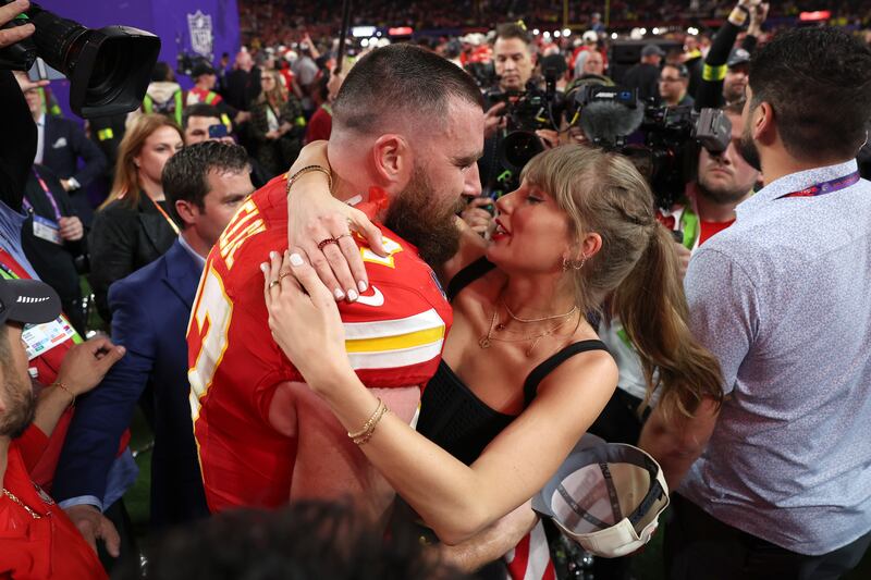 Travis Kelce of the Kansas City Chiefs kisses Taylor Swift after defeating the San Francisco 49ers 25-22 in overtime during Super Bowl LVIII at Allegiant Stadium in February 2024 in Las Vegas, Nevada. Photograph: Ezra Shaw/Getty Images