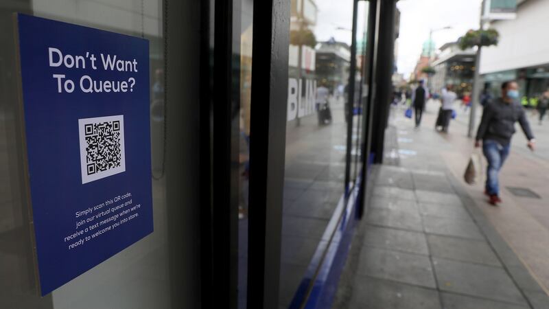 A sign with instructions to join a virtual queue for Arnotts. Photograph: Brian Lawless/PA Wire