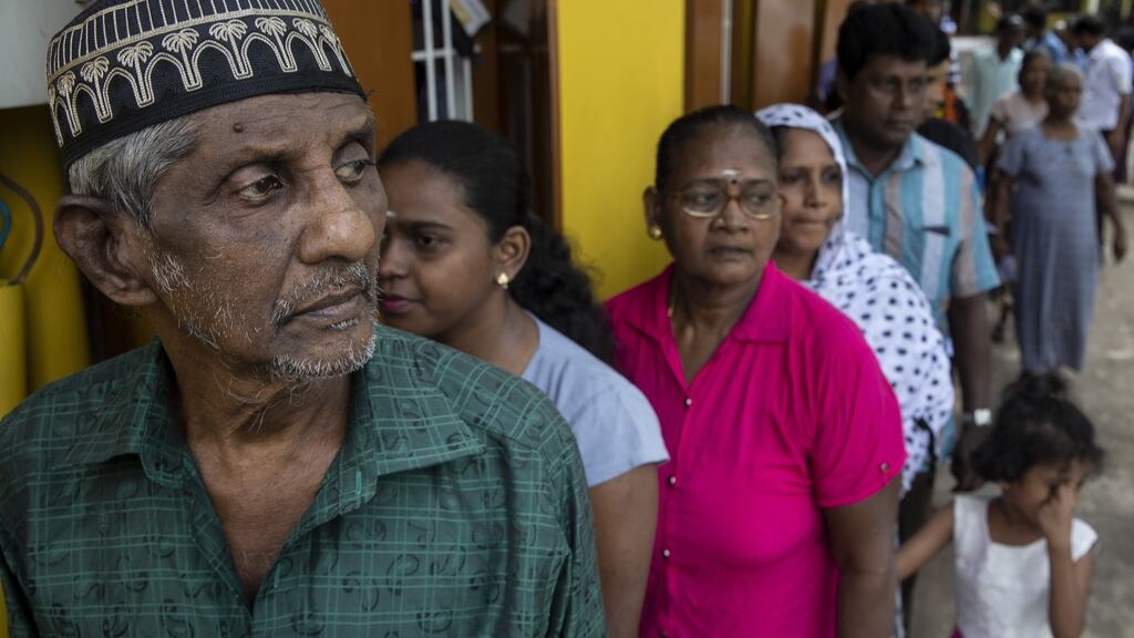 Sri Lankan people wait in line to vote on Saturday to elect a new President in Colombo, Sri Lanka on Saturday. Photograph:  Paula Bronstein/Getty Images