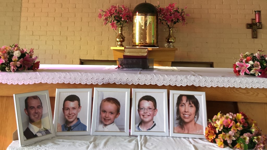 In front of the altar were five photographs: Alan Hawe on the left, his wife Clodagh on the right; between them their three children. Photograph: Peter Murtagh