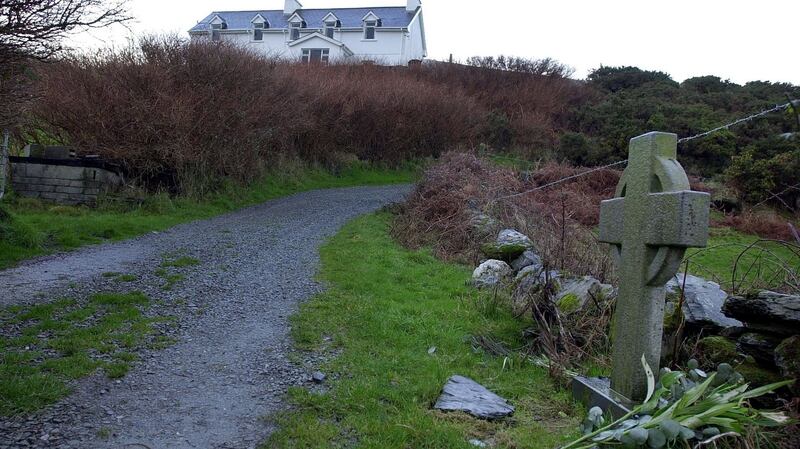 The house belonging to Sophie du Plantier and the cross which marks the spot where she was murdered. Photograph: Eric Luke