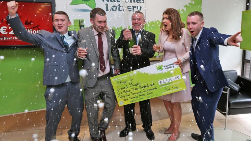 €6.38m lotto winner, Gerard Murphy (third from left), from Ballinrobe, Co Mayo, with his children, Jack, Ger, Laura and Dave, at National Lottery HQ in Dublin this week. Photograph: Colin Keegan/Collins