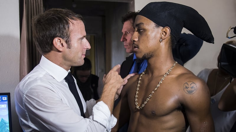 French president Emmanuel Macron speaks with a youth in the Quartier Orleans during a visit to the French Caribbean island of Saint Martinn Saturday. Photograph: Eliot Blondet/Reuters
