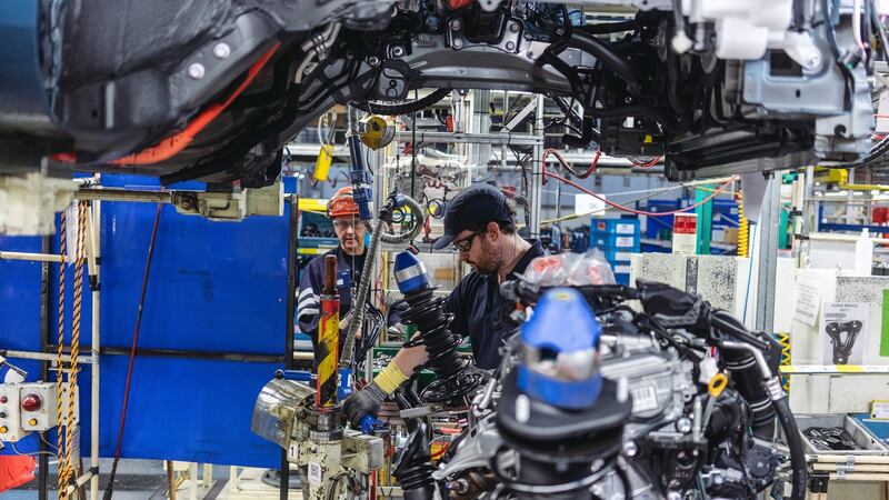An engine is fitted on the assembly line: Toyota has options around the world if the Burnaston plant ultimately proves unprofitable