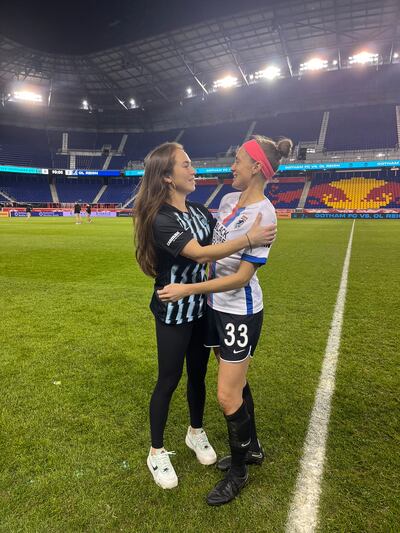 Mana Shim (left) and Sinead Farrelly embrace after the game