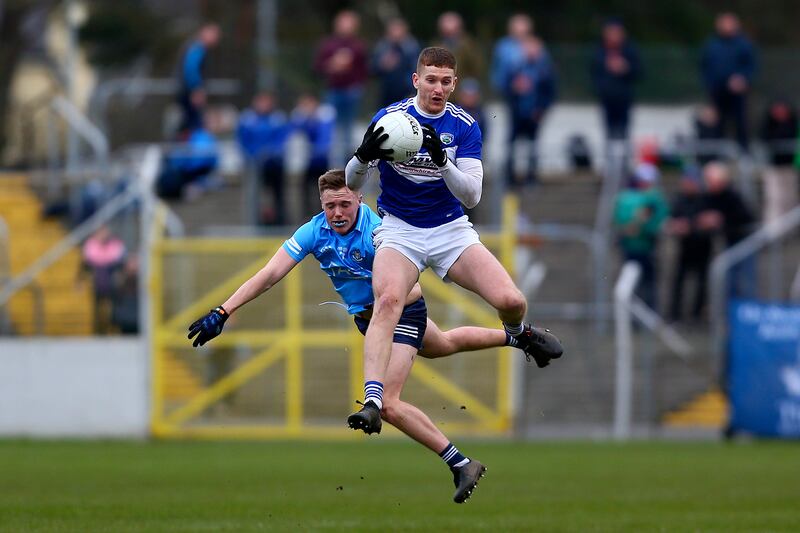 Laois’ Evan O'Carroll wins the ball ahead of Kieran Kennedy of Dublin during the O'Byrne Cup Final at Dr Cullen Park. Photograph: Ken Sutton/Inpho